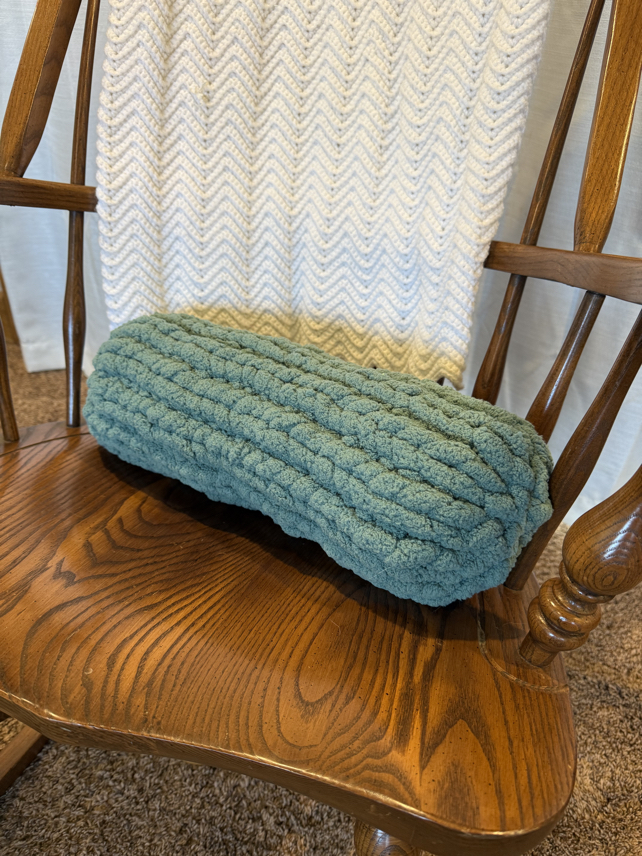 end of the long hand knit pillow