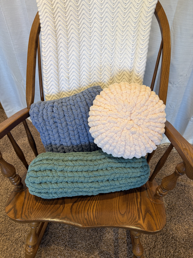 finger knit pillows in a rocking chair