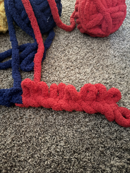 chunky finger knit blanket on the diagonal step 6