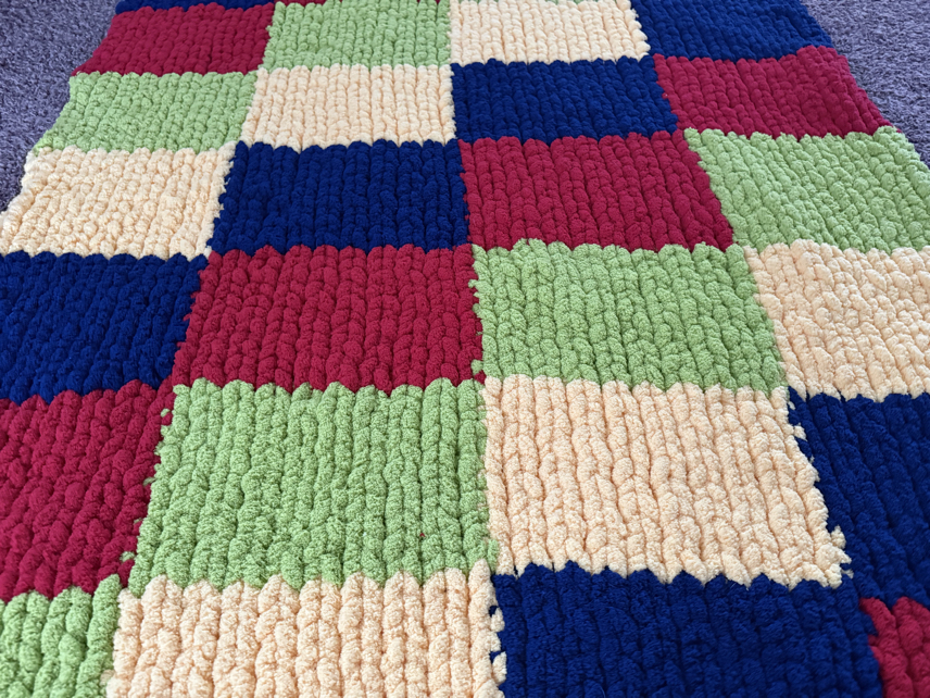 finger knit chunky blanket on the diagonal