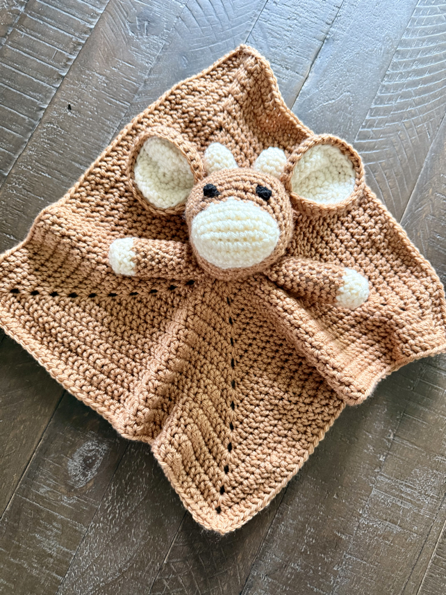 crochet cow head on blanket